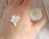 Organic healing balm absorbing into skin of hand GGandJ.com