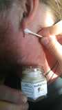 Organic unscented wound care salve being used on stitches