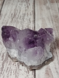 Purple Amethyst on Wood Grain Background