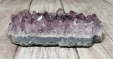 Purple Amethyst on Wood Grain Background