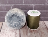 Celestite Sphere with thread spool size reference