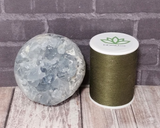 Celestite Sphere with thread spool size reference