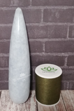 Blue Celestite Wand over wood grain in front of brick Gypsy Gems & Jewelry