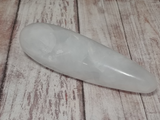 Clear Quartz wand on wood grain background GGandJ.com