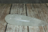 Clear Quartz wand on wood grain background GGandJ.com