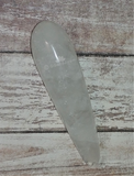 Clear Quartz wand on wood grain background GGandJ.com