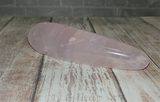 Rose Quartz Wand on Wood Grain Background  GGandJ.com