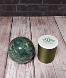 Ruby Zoisite sphere from India with thread spool size reference