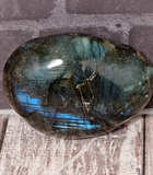Iridescent gemstone gallet on wood grain background Labradorite from Madagascar GGandJ.com