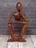 Hand carved person figure from Indonesia