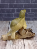 backside of hand carved wooden seal on knot