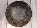 backside of large round oval plate
