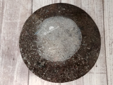 backside of large round oval plate