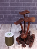 small mushroom wood statue with thread spool size reference