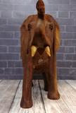Closeup of hand carved wood elephant from Indonesia on GGandJ.com Gypsy Gems & Jewelry Naturally Unique