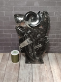 Fossil Statue with thread spool size reference