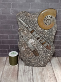 Fossil Statue with thread spool size reference