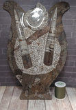 Fossil Statue with thread spool size reference