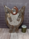 Fossil Statue with thread spool size reference