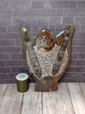 Fossil Statue with thread spool size reference