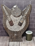 Fossil Statue with thread spool size reference