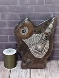 Fossil Statue with thread spool size reference