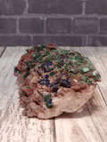 Dolomite on wood grain and brick background