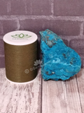 Chrysocolla mineral from Mozambique with thread spool size reference on GGandJ.com Naturally Unique