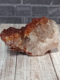 Side View of Hematite Quartz with brick and wood background