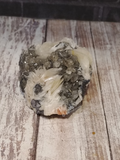 Calcite and Baryte on Galena with wood grain background
