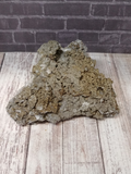 Large piece of rough pyrite on quartz gemstone mineral