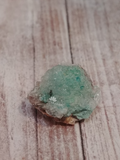 bright green clusters of epidote with clear calcite