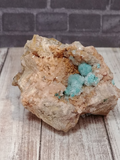 bright green clusters of epidote on peach colored baryte