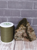 Epidote on Quartz with thread spool size reference