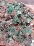 Close up of epidote on baryte barite gemstone Naturally Unique GGandJ.com