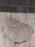 Cobalto Calcite on wood grain and brick background