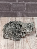 Chalcedony on wood grain and brick background