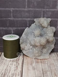 Blue Druzy Chalcedony from Morocco with thread spool size reference