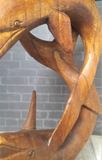 close up of carved wood dolphin duo on GGandJ.com