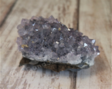 Natural Purple Amethyst Crystal from Brazil on wood grain background GGandJ.com AR7505