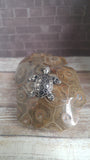 Sea turtle figure with patterned 3D back on hexagon pattern coral