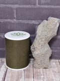 Rough fossil coral with thread spool size reference