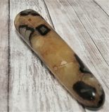 Septarian Wand from Madagascar on GGandJ.com wood grain background