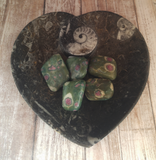 Fossil heart plate with ruby zoisite tumbled pieces