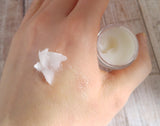 Organic healing balm absorbing into skin of hand GGandJ.com