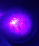 Ruby Zoisite Sphere under UV lighting