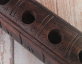 Closeup of handcarved wood flute