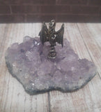 Dragon on natural purple stone