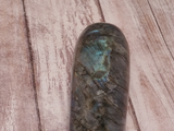 Iridescent gemstone on wood grain background Labradorite from Madagascar GGandJ.com