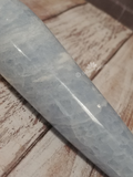 closeup of natural blue gemstone carved wand